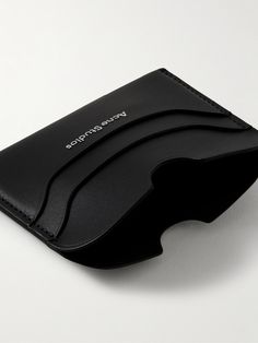 Acne Studios' leather accessories are just as cool and clean-cut as the Scandinavian label's clothing. Notched for easy access to four cards, this holder has been made in Italy from durable leather and has a central compartment for folded bills and receipts. Functional Black Leather Wallet, Functional Black Card Holder For Daily Use, Modern Black Card Holder With Slots, Modern Black Card Holder With Card Slots, Functional Leather Card Holder With Rfid Blocking, Modern Black Card Holder With Rfid Blocking, Modern Black Card Holder With Interior Slots, Functional Black Bifold Card Holder, Modern Black Rfid Blocking Card Holder