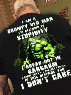 the back of a man's black shirt that says i am a grumpy old man