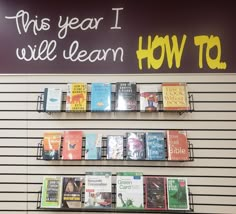 there are books on the shelves in this bookstore's bookcases and it says, this year i will learn how to read