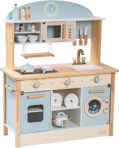 a wooden toy kitchen with blue and white appliances