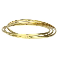 Iconic vintage trinity bangle with diamonds in 18K yellow gold, British hallmarked London 1979. Each bangle features six diamonds held in a diamond cut star setting for added sparkle. The trinity style, reminiscent of the Russian wedding ring style, echoes a cool, traditional glamour and will add sophistication to any outfit. Turn heads in classic glamour, whether in the office, at cocktails or a white tie event. 18 x round brilliant cut diamonds, approximate total weight 0.18 carats, assessed c Bangle With Diamonds, White Tie Event, Russian Wedding Ring, Russian Wedding, Wedding Ring Styles, G H, Round Brilliant Cut Diamond, Gold Bangles, Brilliant Cut Diamond