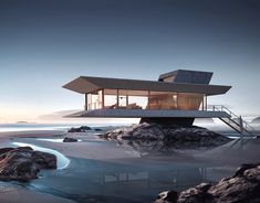 a house on top of a rock near the ocean