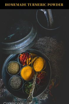 the ingredients for homemade tumericic powder in bowls on a table with a teapot and