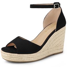 a black wedged sandal with an ankle strap