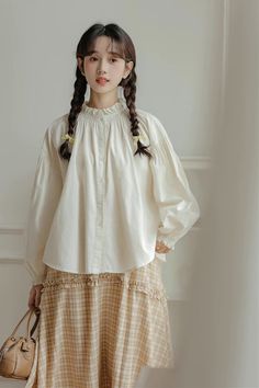 Baggy batwing blouse with a button-down front, long puff sleeves and a ruffled high neckline. One Size: 47" chest, 26" length Puff Blouse, Balloon Sleeve Shirt, Batwing Blouse, Loose Shirts, Long Puff Sleeves, Overall Dress, Sleeveless Shirt, Sweater Blouse, Lantern Sleeves