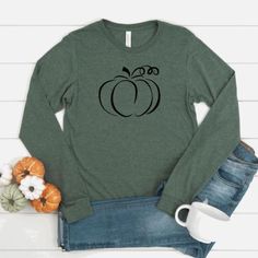 Our shirts are handmade in Ohio by hand with love and care one at a time.We hope you will find a shirt that will inspire you or someone else.DESCRIPTION:Pumpkin Shirt, Fall Long Sleeve Shirts, Autumn Shirt, Fall Shirt Women, Fall Pumpkin Shirt, Fall Long Sleeve T Shirt, Pumpkin Long Sleeve, Autumn Long Sleeve, Pumpkin Long Sleeve tshirt, Pumpkin Longsleeve, Pumpkin Shirt Women, Fall ShirtsThis cute long sleeve pumpkin shirt is perfect for women for this Holiday Season! Show off your holiday spir Fall Graphic Tee Shirt With Long Sleeves, Long Sleeve Graphic Tee For Fall, Fall Relaxed Fit Graphic Tee, Long Sleeve T-shirt With Screen Print For Fall, Graphic Tee Long Sleeve Shirt For Fall, Black Flannel Shirt For Fall, Pre-shrunk Long Sleeve Tops For Fall, Fall Cotton Graphic Tee Shirt, Graphic Cotton Tee For Fall