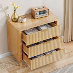 a wooden table with drawers and a radio on top