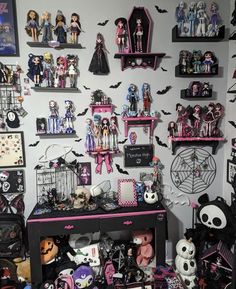 a room filled with lots of halloween decorations and doll figurines on the wall