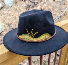 Up your fashion game this spring with this addition to your closet. This gorgeous bohemian style wide-brim felt hat with a hand-embroidered mountains and sun scene. Eclectic, boho and modern style all in one! A wonderful item to add to your closet for any woman who likes to stand out and make a statement with her fashion. Adjustable ❁ Fashionable ❁ One Size Fits Most ❁ Sun Protection ❁ Statement Piece ❁ Hand Embroidered  This is a beautiful one-of-a-kind, hand stitched statement fashion piece - Bohemian Hat Bands For Spring Festival, Bohemian Spring Fedora With Curved Brim, Spring Bohemian Fedora With Curved Brim, Bohemian Spring Fedora One Size Fits Most, Bohemian Adjustable Fedora For Spring, Spring Bohemian Adjustable Fedora, Spring Bohemian Fedora, Bohemian Wide Brim Fedora, Black Bohemian Felt Hat For Summer