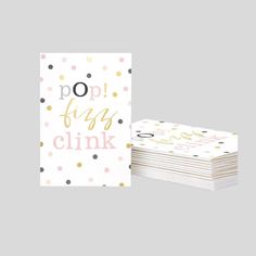 two greeting cards with the words pop fly clink in gold and pink on them