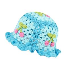 a crocheted blue hat with pink flowers on the front and green leaves on the back