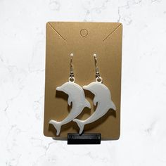 Beautiful Dolphin Earring Set - Sterling silver hook with push back Made with strong and durable PLA plastic. Great Gift idea Free Fast UK Shipping on all orders  Dispatched same day Thanks for looking White Fish Hook Earrings As Gift, Luxury Ocean-inspired Earrings For Gift, Ocean-inspired Drop Earrings For Gifts, Ocean-inspired Single Earring As Gift, White Drop Earrings With Fish Hooks, White Dangle Earrings With Fish Hook, Resin Dolphin Earrings, Dolphin Gifts, Shamrock Earrings