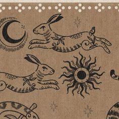 an image of rabbits in the sun and moon on burlock paper with polka dots