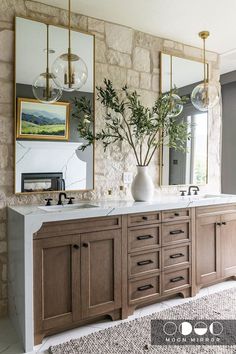 a large bathroom with two sinks and mirrors on the wall next to each other in front of a window