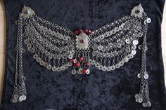 In the Ottoman period, women wore silver jewelry over their fez hats. This product original Ottoman Fez hat jewelry with natural red stones. It is handmade. Elegant Red Ceremonial Headpieces, Handmade Bohemian Silver Headpiece, Handmade Silver Ceremonial Headpiece, Handmade Red Festival Headpieces, Red Handmade Festival Headpieces, Handmade Silver Headpieces For Ceremonial Occasions, Handmade Red Headpieces For Festivals, Elegant Silver Necklace For Traditional Ceremonies, Turkish Jewelry Ottoman