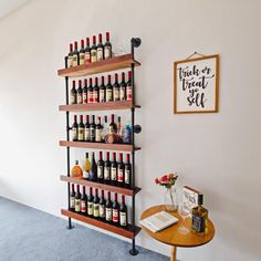 there is a wine rack in the corner of this room with many bottles on it