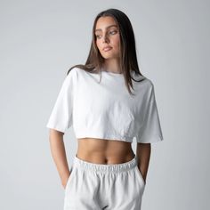 Our latest cropped tee is contoured to perfection with our Dart fabric technique. Our goal was to create a piece that’s super relaxed and extremely flattering all at the same time. This piece is made from 100% heavyweight jersey cotton and features dropped shoulders and vertical darts. Our darts are placed at the front and back of the tee providing the perfect shape to enhance your curves. Tailored by TALENTLESS. White Cotton Crop Top With Cropped Hem, Cropped Boxy Fit Tops, Boxy Fit Cropped Tops, Summer Cropped Athleisure Shirt, White Relaxed Fit Crop Top, White Relaxed Fit Crop Top With Cropped Hem, Sporty Boxy Fit Cropped T-shirt, Boxy Cropped Tops, Sporty Relaxed Fit Cropped T-shirt