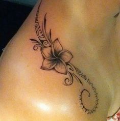 a woman's stomach with a flower tattoo on it