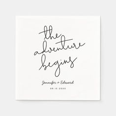 the adventure begins wedding napkins in black ink on white paper, with handwritten lettering