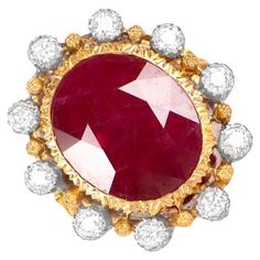 This exquisite vintage Buccellati ring features a natural Burma ruby weighing approx 7.41 carats, set in 18k gold with diamond accents. The ring's delicate and intricate handcrafted engravings add to its unique charm and elegance. Ring Size: 6.5 US, Resizable Diamond Size: Approximately 7.41 Metal: Gold Stone: Diamond, Ruby Stone Cut: Oval Cut Style: Art Deco Luxury Antique Ruby Ring, Luxury Fine Jewelry Ruby Ring With Cabochon, Rare Collectible Ruby Ring, Buccellati Rings, Luxury Multi-stone Vintage Ruby Ring, Vintage Platinum Rings, Exquisite Luxury Multi-stone Ruby Ring, Italian Art Deco, Colombian Emerald Ring