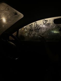 the interior of a car with graffiti on it