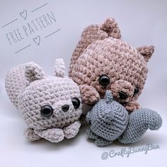 three crocheted stuffed animals sitting next to each other