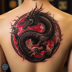 a man's back with a dragon tattoo on his upper and lower back side