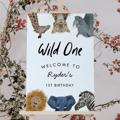 a sign that says, wild one welcome to roger's 1st birthday with pictures of animals on it