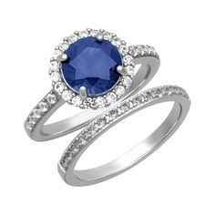 an oval blue sapphire and diamond ring set with matching wedding bands in white gold,