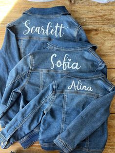 Custom made denim jackets for your kiddos everyday wear! Add some unique style to your loved ones wardrobe with our personalized denim jacket.  Size of name may vary depending on how long or short their name is. Please keep in mind that I can only go as long or tall as the upper shoulder of the jacket is. For example The name 'Ava' will be a lot large vs a longer first/middle name like 'Anastasia White'. I don't have all the size listed, but if you don't see the size you want, I am able to get size 12 months all the way up to big girl size 14.  All names will be printed in white. Material is iron on vinyl. (Pick which front you want, theres 4 options) Washing instructions: hand wash on cold and hang to dry. This is a medium wash denim Please email me the name and front you want. Customizable Denim Jacket For Fall, Customizable Blue Denim Jacket, Customizable Denim Jacket For Spring, Customizable Long Sleeve Denim Jacket, Spring Customizable Denim Jacket, Customizable Denim Jacket, Customizable Cotton Denim Jacket For Fall, Customizable Blue Denim Jacket With Long Sleeves, Customizable Fitted Denim Jacket Casual Style