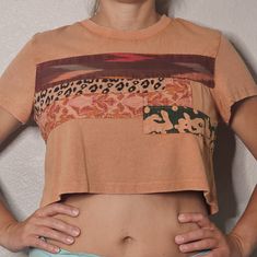 1/2 Off Women's Urban Outfitters Cropped Peach Shirt Medium Animal Floral Prints Add A Pop Of Color And Hint Of Animal Print To Your Wardrobe With This Urban Outfitters Cropped Shirt. The Short-Sleeved Crew Neck Top Features A Vibrant Orange Color And A Unique Animal Floral Print Patchwork Design. It's Made From 100% Cotton For A Comfortable Fit, And The Pullover Closure Makes It Easy To Wear On Any Occasion, Whether It's For Travel Or A Casual Day Out. This Regular Fit Shirt Comes In A Size Med Brown Cotton Patchwork Tops, Relaxed Fit Summer Tops With Patchwork, Orange Short Sleeve Crop Top For Summer, Brown Cotton Crop Top, Peach Short Sleeve Shirt For Summer, Casual Peach Summer Shirt, Peach Cotton Summer Shirt, Summer Peach Cotton Shirt, Peach Short Sleeve Summer Tops