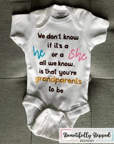 a baby's bodysuit with the words we don't know what it is