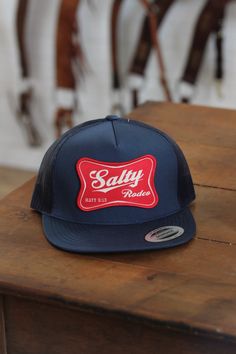 a blue and red hat sitting on top of a wooden table