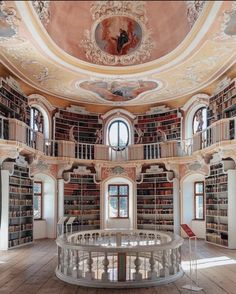 the circular room has many bookshelves in it