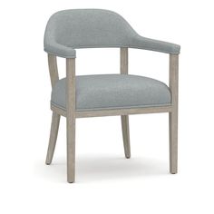 the arm chair is upholstered with grey fabric