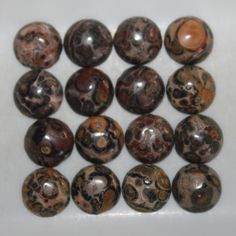 a group of marbles sitting on top of a white table