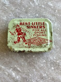 an old tin box that says best little stinkers for all sport fishing