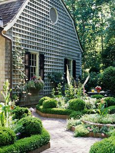 a house with lots of plants around it