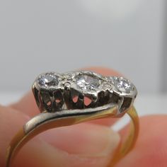 Estate antique diamond three stone ring. 35ctw. clean old cut stones g/vs. size 5.5. beautiful and comes in ring box. 2grams. the platinum is the full top the rest is 18k yellow gold. Antique Three Stone Round Cut Rings, Antique Three Stone Round Rings, Victorian Three Stone Round Cut Ring, Victorian Three-stone Round Cut Ring, Antique Rings With Vs Clarity For Anniversary, Antique Three-stone Rings For Formal Occasions, Antique Diamond Ring With Vs Clarity For Anniversary, Antique Style Diamond Ring With Vs Clarity, Formal Cluster Three Stone Rings