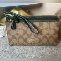 Signature Coated Canvas And Refined Pebble Leather, Fabric Lining. Wrist Strap Attached. Eight Credit Card Slots. Double Zip Closure. Fits All Hone Sizes Up To An Iphone X And Samsung S7 Edge. 8.0”(L) 4.75(H) 1.0”(W) Coach Clutch With Zipper For Daily Use, Coach Rectangular Clutch, Coach Rectangular Clutch For Daily Use, Coach Rectangular Wallet For Shopping, Coach Wallets With Zipper Closure For Everyday Use, Coach Wallets With Zipper Closure, Everyday Use Coach Crossbody Clutch, Coach Clutch For Daily Use, Coach Coin Purse With Zipper For Everyday Use