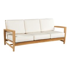 a white couch sitting on top of a wooden frame