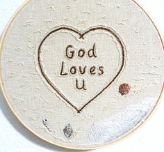 a heart with the words god loves u on it