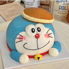 a cake shaped like a cartoon character on top of a table