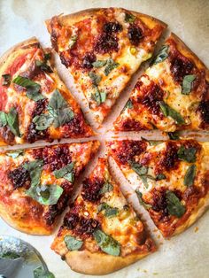 a pizza cut into eight slices on top of a table