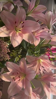 pink flowers in a vase on a table