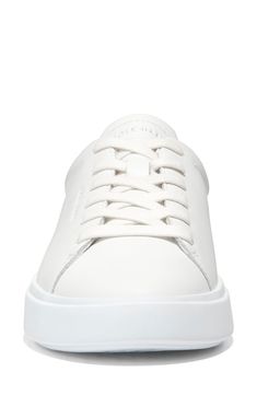 This sleek leather sneaker with clean lines inspired by classic tennis styles has rubber caps at the toe and heel for added traction. Round toe Lace-up style Removable cushioned footbed Leather upper/textile lining/synthetic and rubber sole Imported White Sole Platform Sneakers With Embossed Logo, White Platform Sneakers With Embossed Logo, Classic Low-top Platform Sneakers With Embossed Logo, Classic White Platform Sneakers With Textured Sole, Classic Platform Sneakers With Embossed Logo And Lace-up, Classic White Leather Platform Sneakers, Classic Platform Sneakers With Embossed Logo, White Sneakers With Embossed Logo For Spring, Spring White Sneakers With Embossed Logo