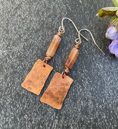 These simple citrine and copper earrings will add a little glow to your life. Handmade with love. Approximately 1 3/4 inches in length. Artisan Copper Earrings For Everyday Wear, Artisan Copper Earrings For Everyday, Soldered Copper Earrings As A Gift, Earthy Soldered Earrings For Gift, Orange Copper Earrings For Gift, Rectangular Copper Earrings With Ear Wire, Handmade Rectangular Copper Earrings, Amber Copper Earrings As Gift, Handmade Rust Earrings For Gift