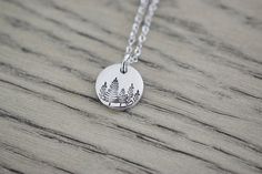 Evergreen Tree Necklace - Treescape Necklace - Winter Tree Forest Necklace - Small Tree Charm Pendant - Aluminum disc is lightweight, very low skin reaction rate, won't tarnish & won't turn your skin green! - Each disc is hand punched, tumbled to an awesome shine, stamped by hand, and then oxidized for contrast - Aluminum Disc is 1/2 inch (13mm) (1.25cm) - Smaller than a dime (see photo 5) - Chain options are an 18 inch or 24 inch Stainless Steel Cable Link Chain with Lobster Claw (Shown) or Green Nature-inspired Everyday Jewelry, Everyday Green Nature-inspired Jewelry, Forest Necklace, Winter Tree, Stainless Steel Cable, Tree Necklace, Tree Forest, Winter Trees, Small Trees