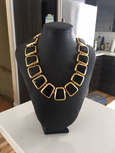 "Beautiful Anne Klein statement necklace. Modernist design in a shiny gold tone and black enamel featuring a toggle closure. CONDITION In excellent vintage condition. No wear, marks or damage. Closures are all secure The necklace measures approximately 17 3/4 inches and 1 1/8\" wide. The necklace is signed with © Anne Klein on one side of the tag and the lion's head on the underside. The necklace is also signed ©AK on a cartouche on one link. It is in excellent vintage condition Please see this Vintage Black Metal Chain Necklace, Modern Gold Necklace With Black Enamel, Retro Black Metal Necklace, Gold Jewelry With Black Enamel For Party, Gold Necklace With Black Enamel For Formal Occasions, Vintage Black Enamel Necklaces For Evening, Vintage Black Enamel Necklace For Evening, Vintage Black Enamel Necklaces For Formal Occasions, Vintage Black Enamel Necklace For Formal Occasions