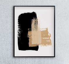 an abstract painting in black, beige and grey on a white wall above a wooden frame